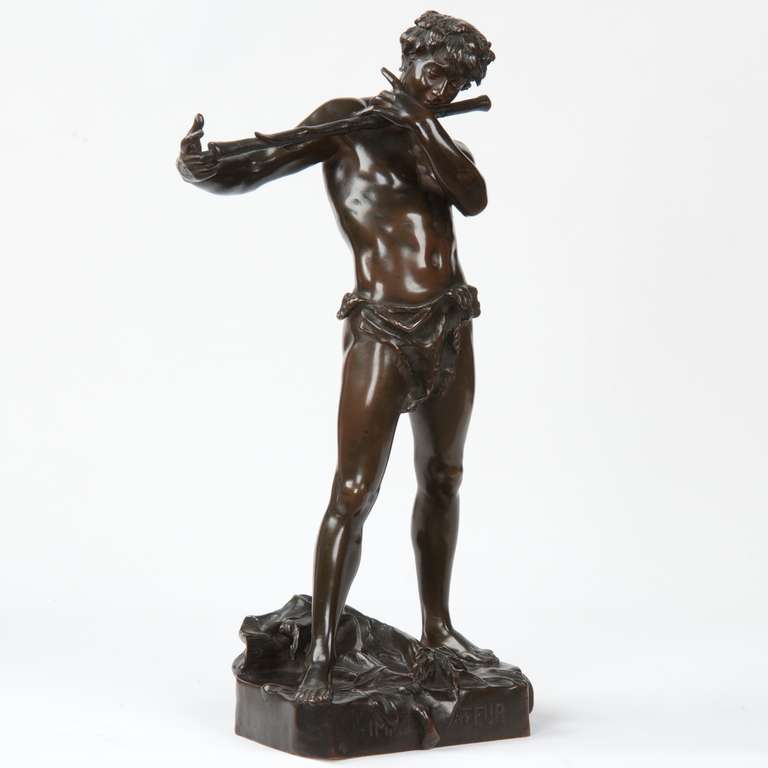 An exceptional antique bronze sculpture capturing the mythological Pan with his flute, the work is an expression of the naturalism that overtook the arts in the late 19th century. Originally exhibited in plaster at Salon in 1887, 