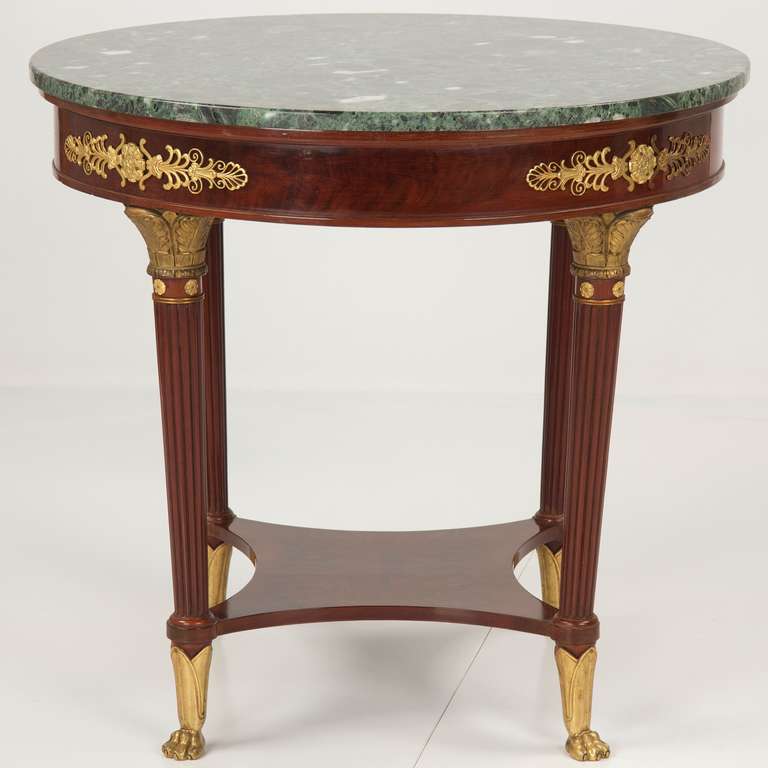 Featuring a wonderful polished original green marble top, drilled in two places beneath to perfectly rest on two steel knobs from beneath, this fine gueridon boasts a large comfortable surface - the top remains in pristine condition. The round frame