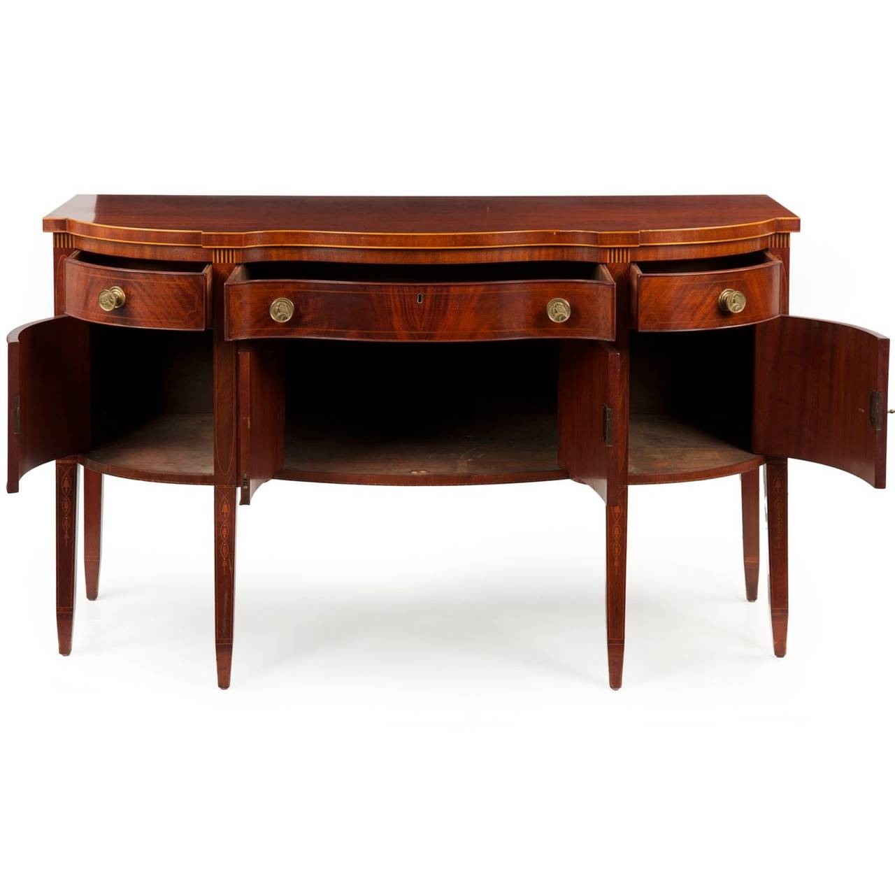 The vibrant and flowing grains of the mahogany veneers throughout the front of this finely crafted sideboard are selected with precision to create a rib-cage effect in all three sections of the facade - it is an absolutely gorgeous effect that flows