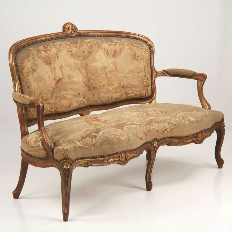 FRENCH LOUIS XV STYLE SETTEE W/ ORIGINAL AUBUSSON UPHOLSTERY
Circa 19th Century

An absolute treasure, this fine French Louis XV Style Settee still retains it's original hand stitched Aubusson upholstery. The scene is a work of art, the back