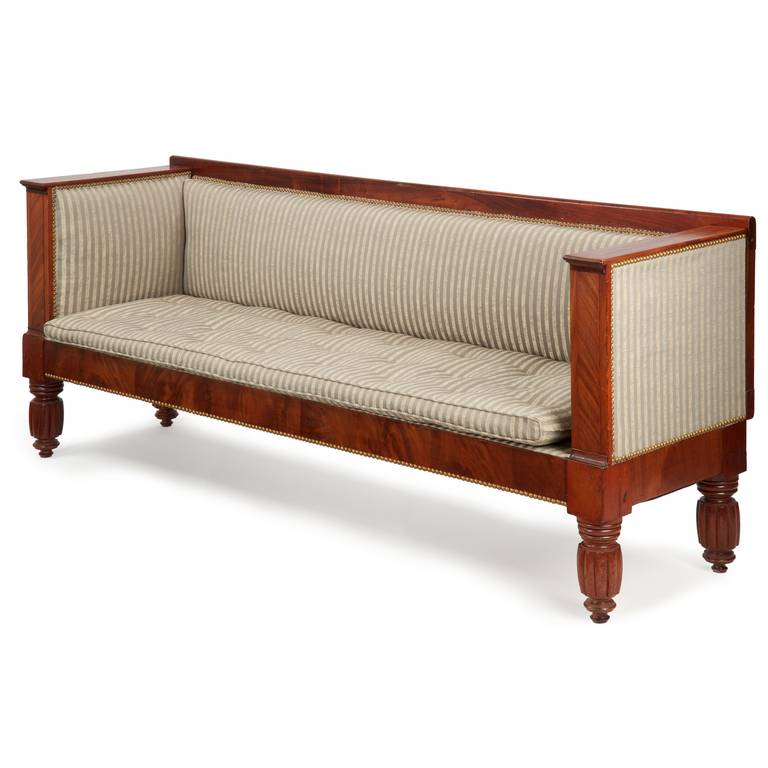 FINE AMERICAN CLASSICAL MAHOGANY BOX SOFA
New York, c. 1840

This austere and attractive form is distinctly influenced by designs from England and France during the first quarter of the 19th Century, this form known as a 