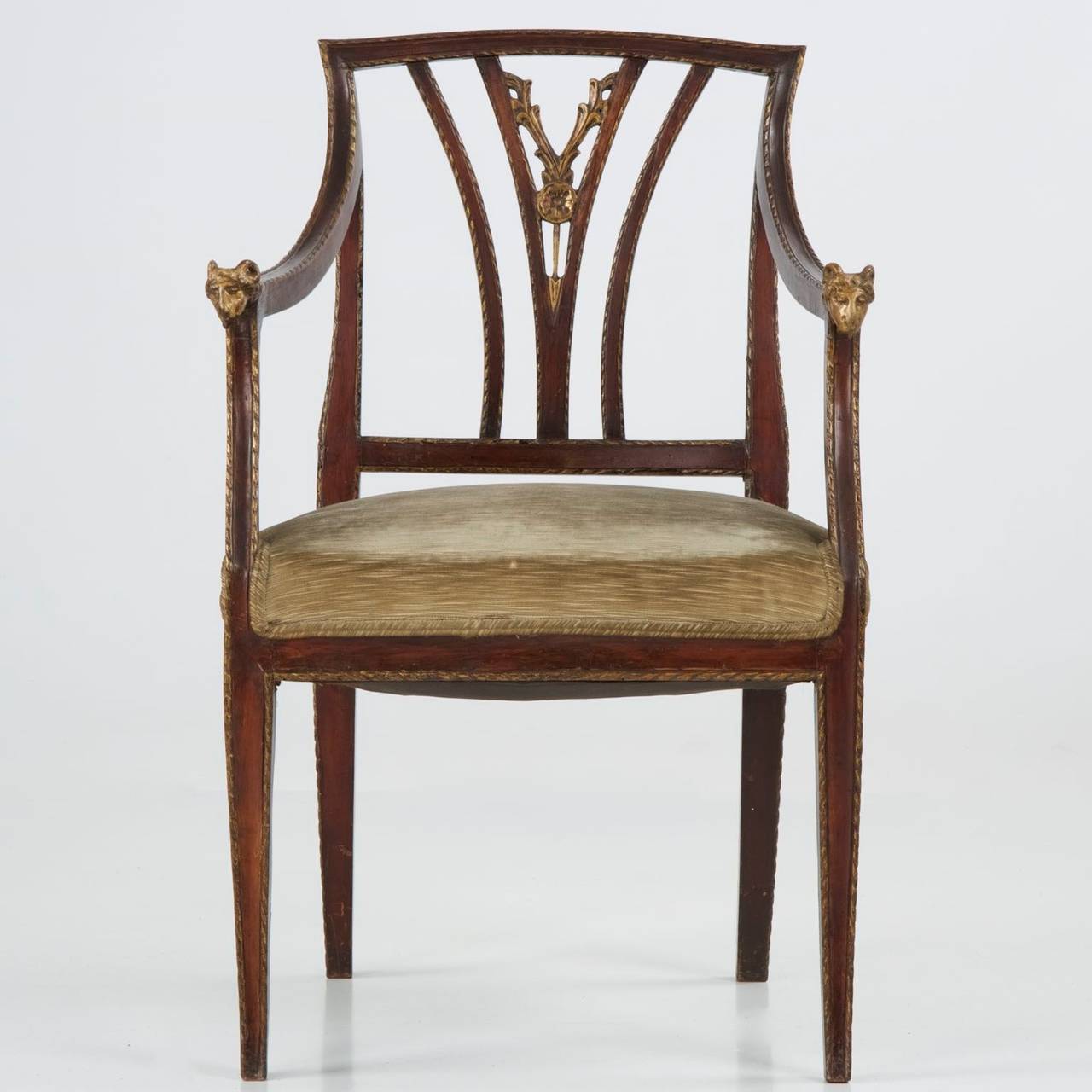 Probably circulating from the middle of the 19th Century, this beautiful Italian Neoclassical arm chair is intricately carved in the pierced splat. The hand tooling marks remain mostly unfinished in the secondary portions of the carvings, the uneven