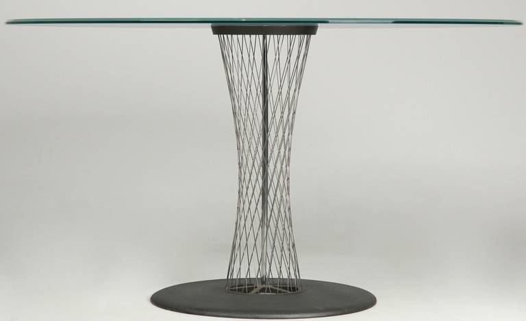 SCULPTED WIRE AND CAST IRON CIRCULAR DINING TABLE BY ANDREAS STOERIKO FOR B&B ITALIA
Last Quarter of the 20th Century
Item # 130007TLP13 

This most striking piece was designed by Andreas Stoeriko for B&B Italia. The heavy and thick thick