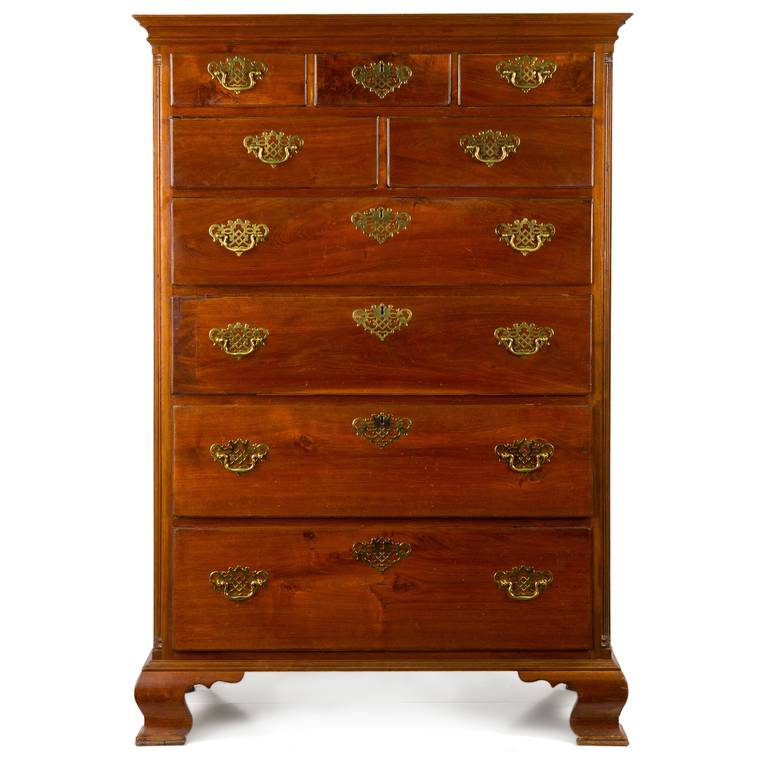 A bold and impressive object, this chest originates in southeastern Pennsylvania, possibly the Delaware River Valley.  The cabinetmaker chose vivid walnut planks that lend some drama to the surface.  Cove molding around the crest projects over three