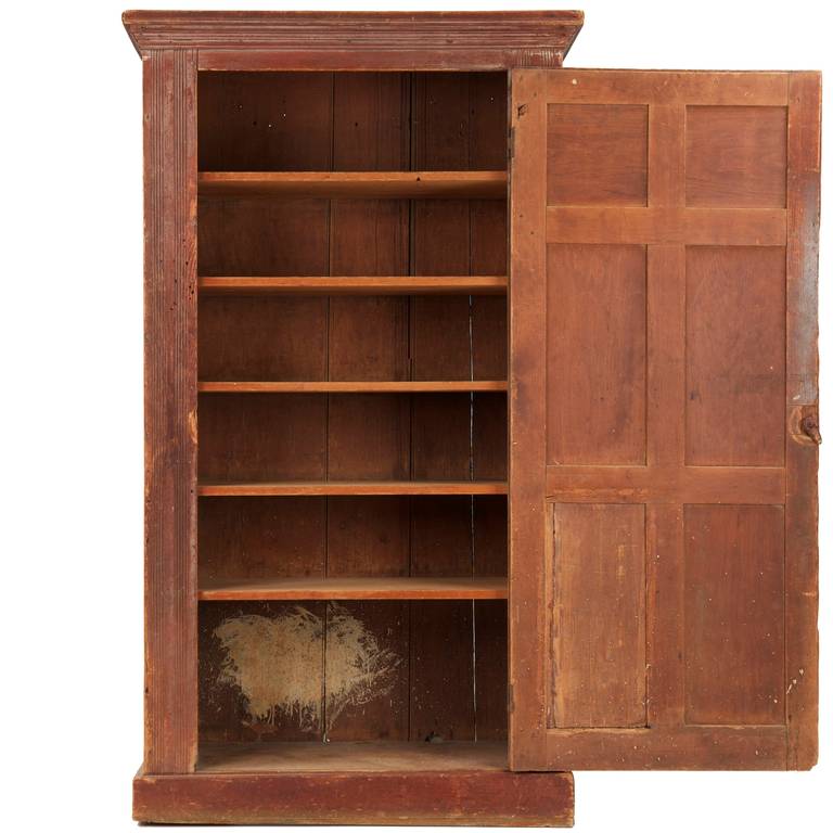 AMERICAN RAISED PANEL PRIMITIVE PAINTED CABINET
Pennsylvania, 19th Century

A rustic antique raised panel cabinet that probably emanated from the hand of a rural craftsman or even homestead craftsman, it retains much of it's original surface, the