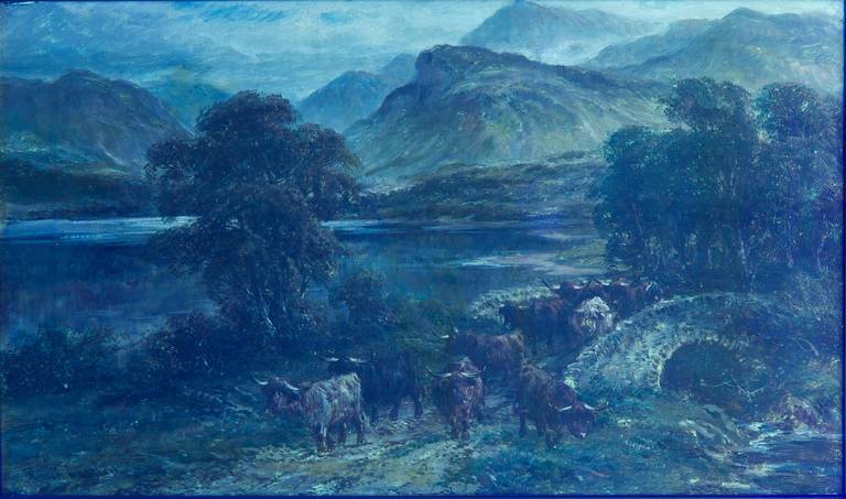 This is a gorgeous antique oil landscape painting on canvas of cattle at a highland lake, a bright and cheery work with a beautiful mountainous view over the cold blue loch.  It is identified on the frame as a depiction of 