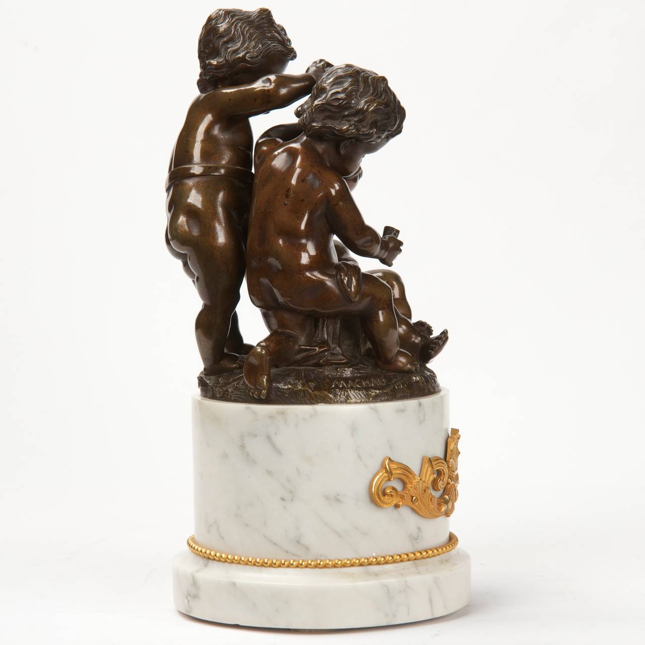 This is a very finely cast sculpture of three putti intensely focused on a game of dice, the standing figure betting his apple on the result of the toss. The three figures are so serious, the seated figure pensive as he counts the dice, the standing