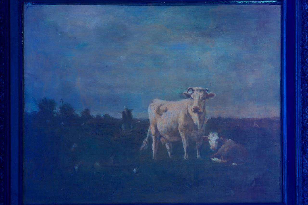 This attractive work by Emil van Marcke captures a group of cattle lounging in a plush pasture as the farmer's wife approaches from a distance.  It is carefully detailed while maintaining that certain dreamy prelude to impressionism found in