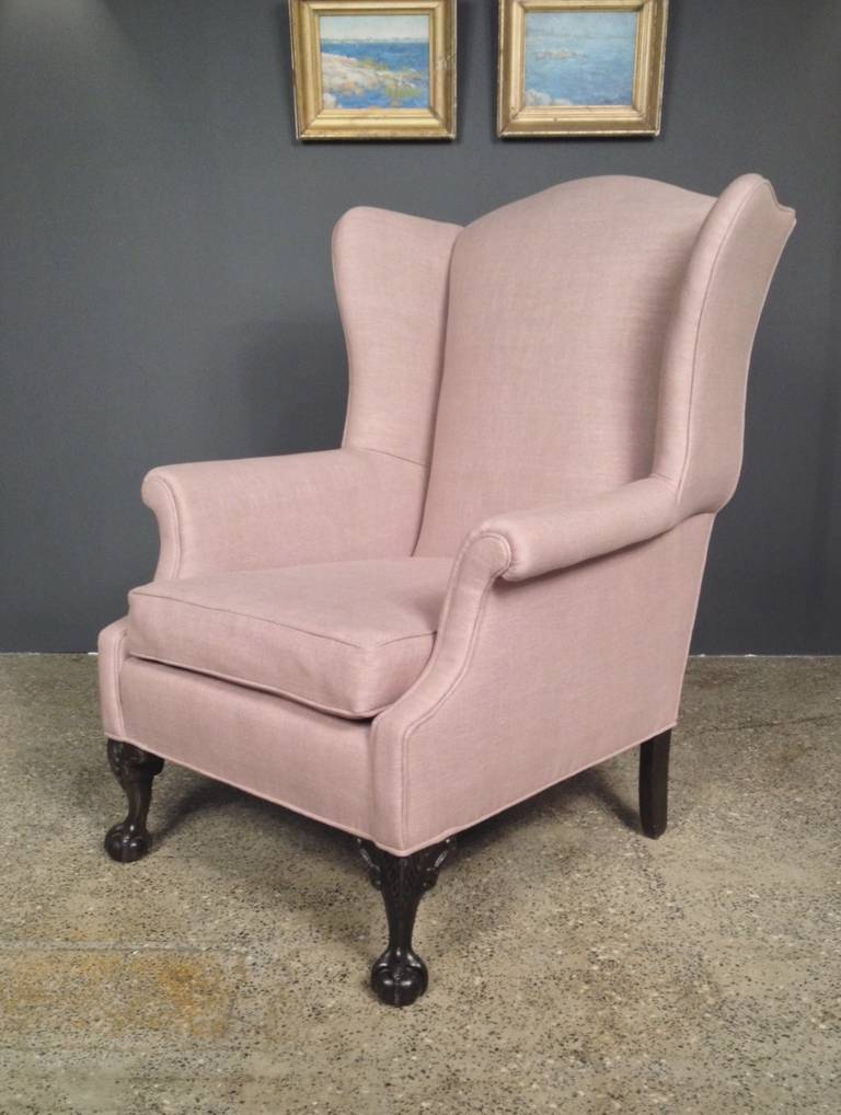 Chippendale style wing chair with claw and ball feet. The wings are nicely flared, back has a serpentine crest rail. New England, circa 1840.