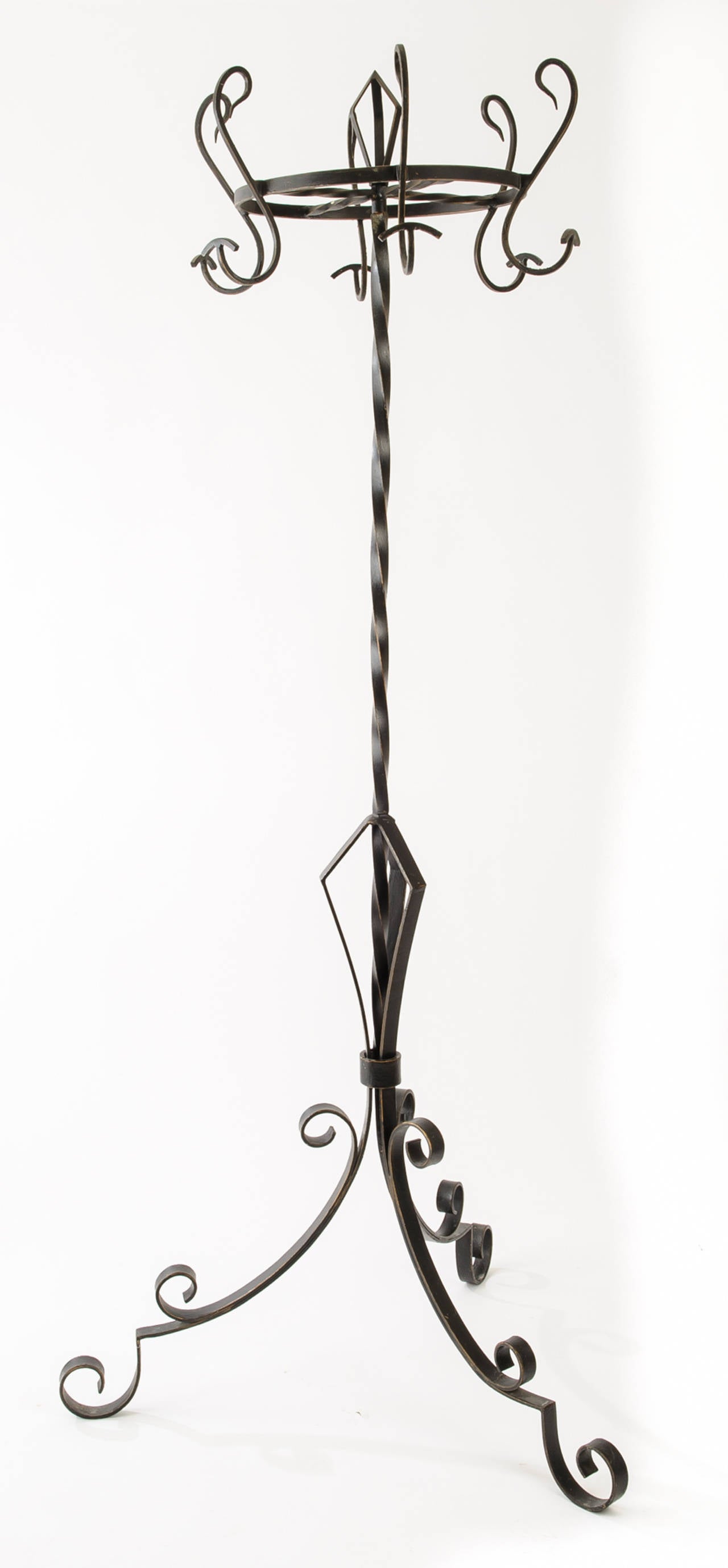 Large early Art Deco iron hat and coat rack that is likely from a French Brasserie.
Holds six hats and coats.