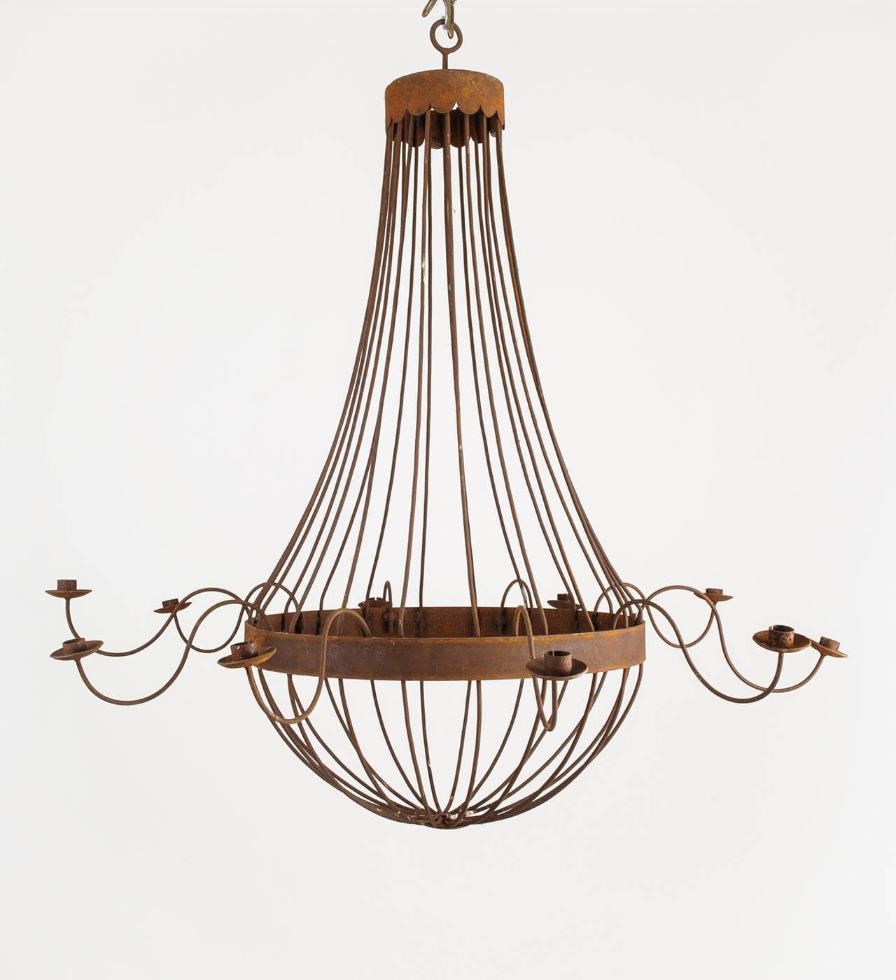Rusted French bell chandelier with ten arms. This extra large fixture makes a wonderful statement. It is ready to be electrified or use with candles. The arms can be detached for easy shipping.