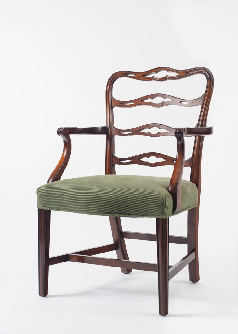The set of reproduction mahogany ladder back chairs are by Saybolt and Cleland, a Philadelphia firm that produced fine quality furniture in the 
mid-20th century. There are two armchairs and six side chairs with upholstered fabric from Brunschwig &