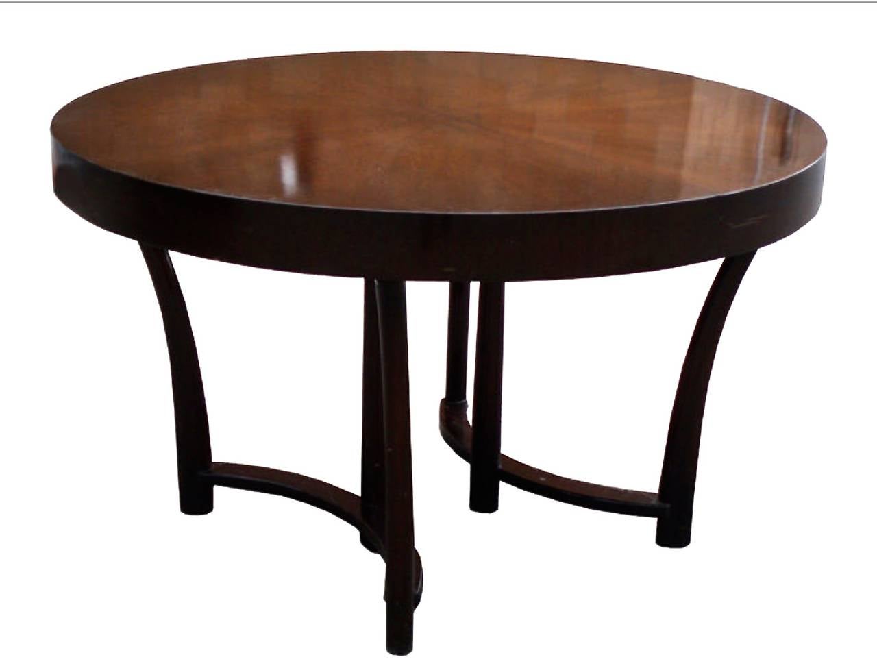 Newly refinished walnut dining table with unusual starburst veneer top and three extension leaves. Designed by T.H. Robsjohn-Gibbings for Widdicomb, USA, circa 1950s. This table can be transformed from round to elongated oval by the addition of one,