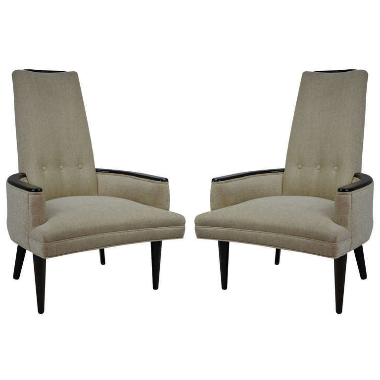 Great scale and tall backs walnut lounge chairs in the style of James Mont, newly refinished and reupholstered. Exposed wood trim on arms and back.

Please contact me to make sure item is available to view in the gallery.
