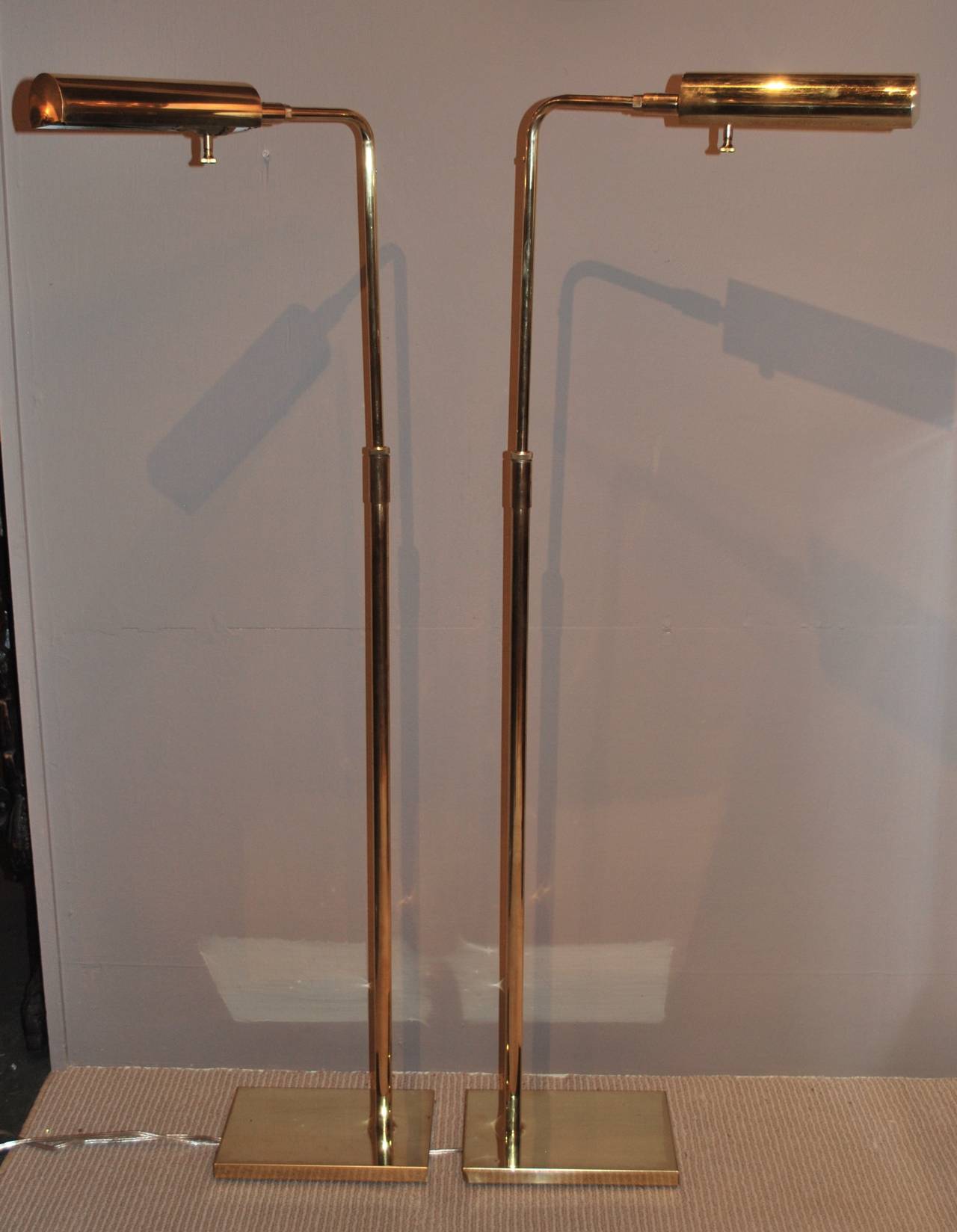 Newly polished and rewired pair of adjustable Koch and Lowy floor lamps.