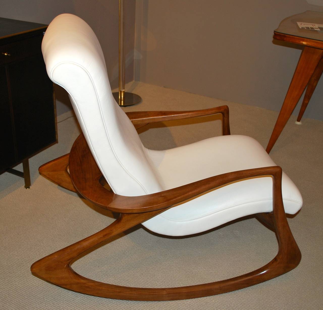 Incredibly sculptural rocking chair by Vladimir Kagan, designed in 1953, newly upholstered in ivory leather. Walnut frame in excellent vintage condition.
This example is from the 1970s.