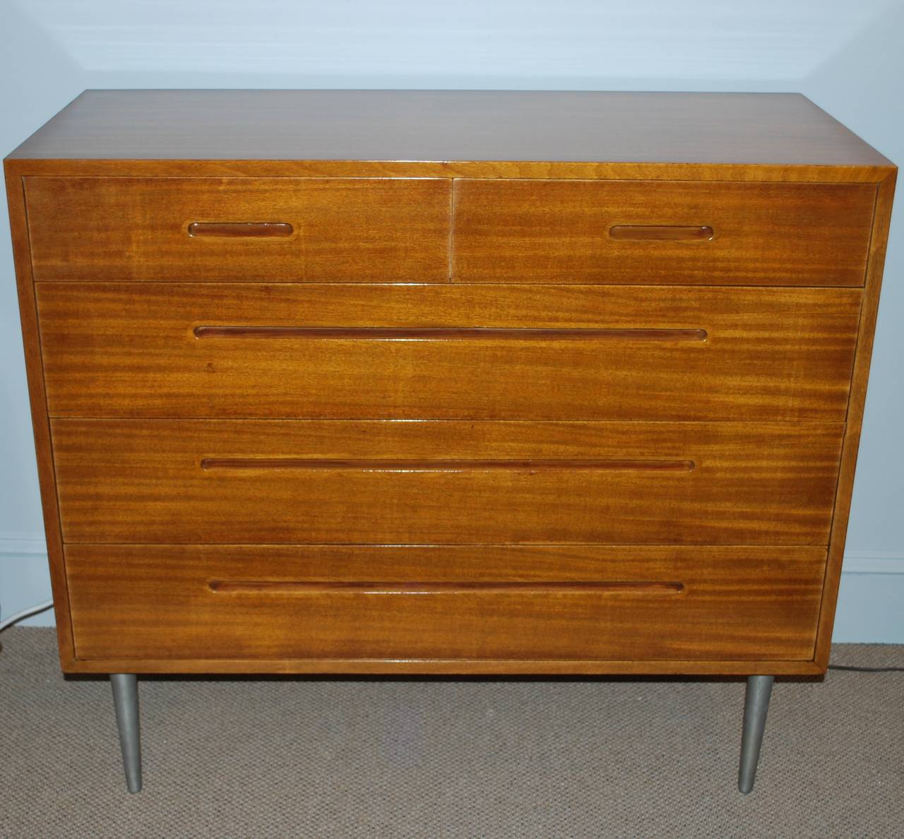 Newly restored, light mahogany chests, designed by Edward Wormley for Dunbar, special ordered on tall, tapered steel legs, purchased in 1950.
Original order, sales receipt and other documentation accompanying.