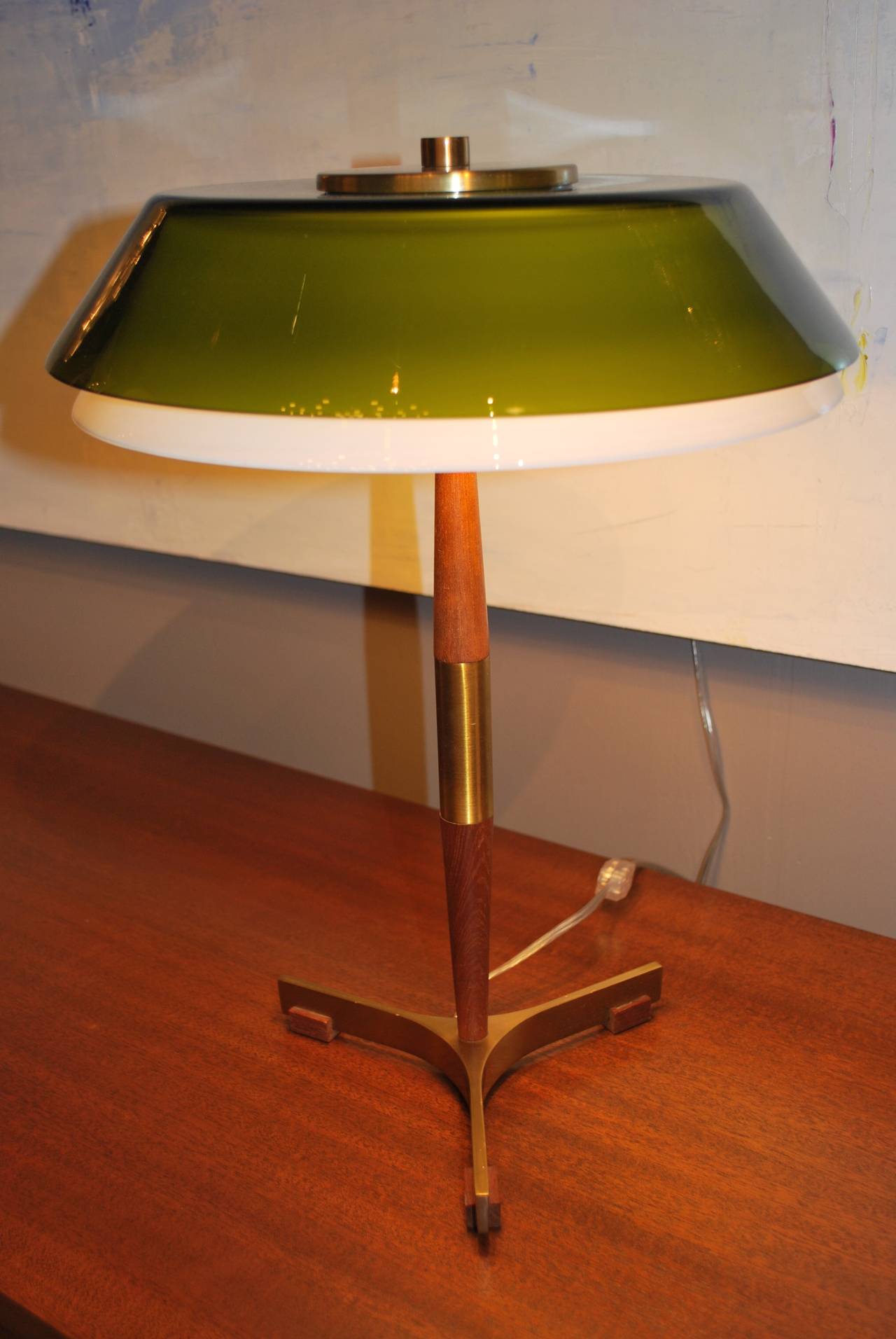 Elegant desk lamp with white milk glass shade and additional green shade by Jo Hammerborg, Denmark, produced in 1963. Teak body with brass base and details. Newly electrified. Label on green shade.
