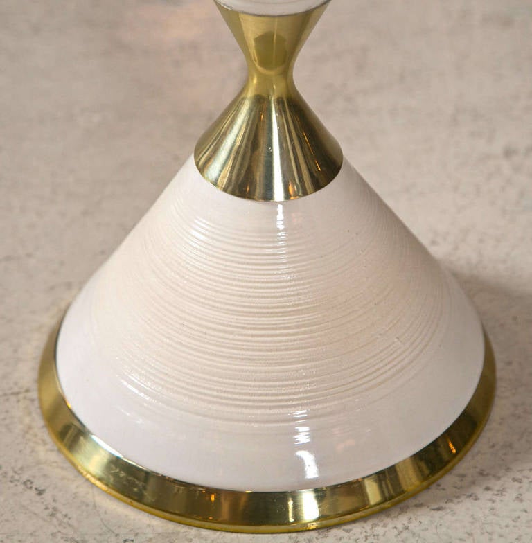 White glazed pottery with brass accents lamps by Gerald Thurston.
Newly rewired. Original hardware and finials intact.