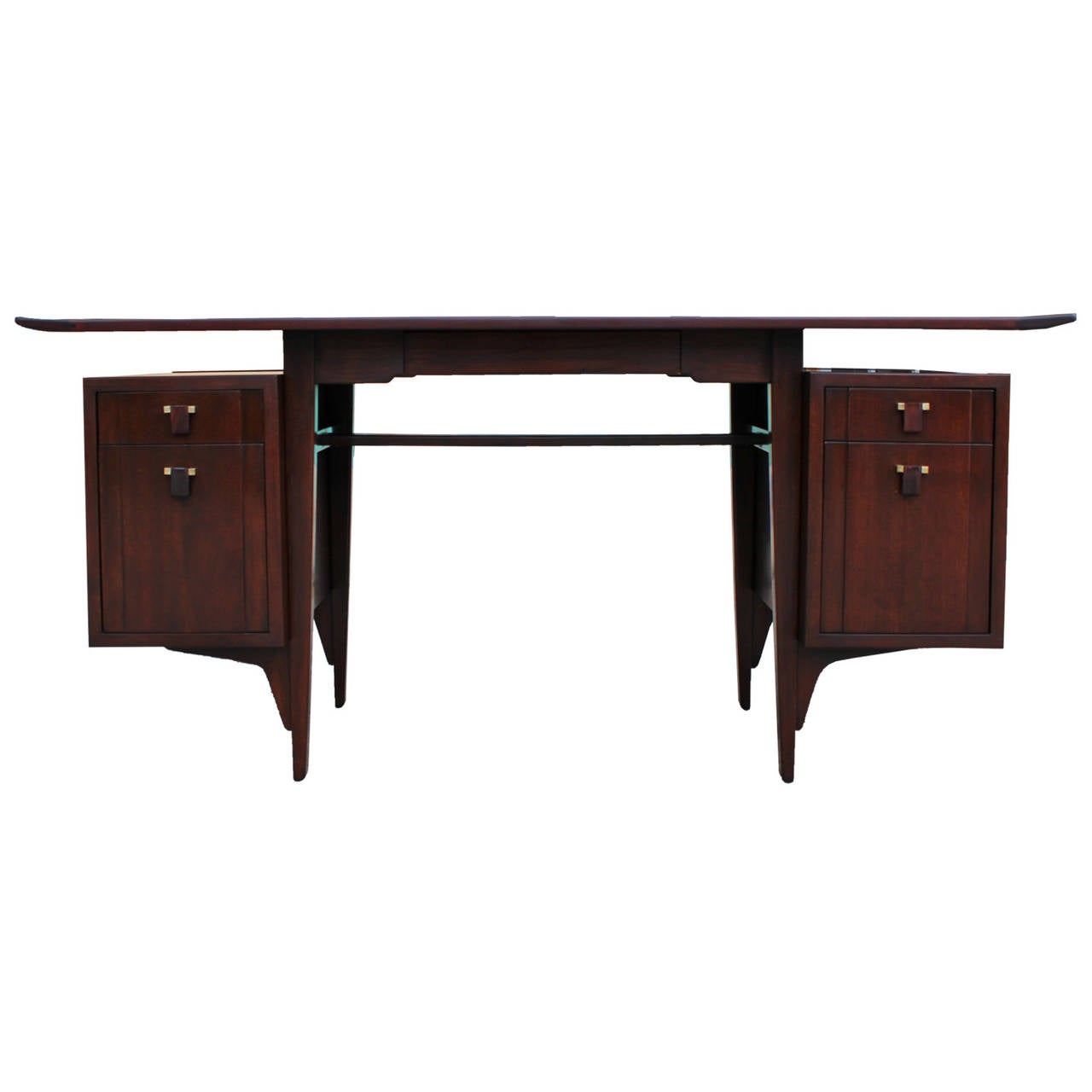 Stunning and rare desk by Edward Wormley for Dunbar mahogany desk. Desk features a slightly upturned floating top. Desk has five drawers. The four drawers on either side are accented with brass and rosewood pulls.