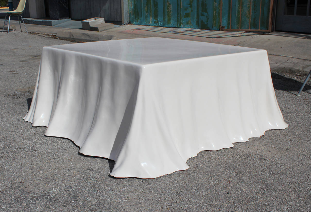 Trompe l'oeil draped handkerchief table designed by Alberto Bazzani for Stendig. Coffee table is constructed of fiberglass. Table has minor wear and small chips around bottom edges. A true conversation piece.