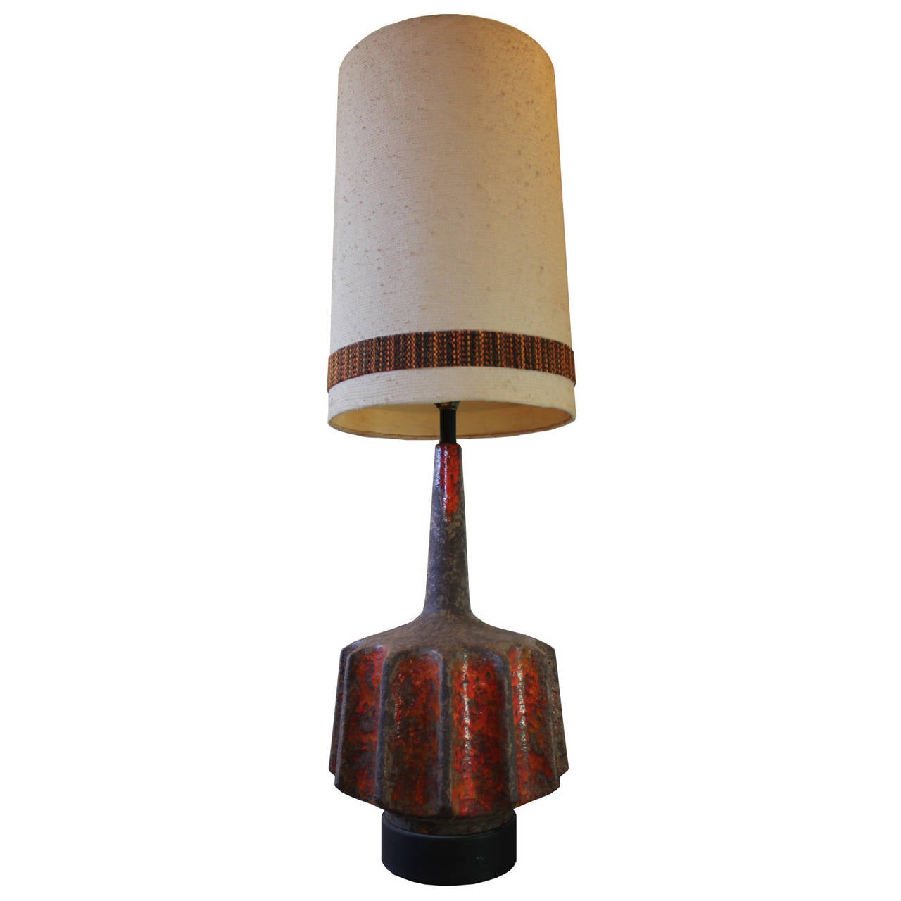 Great Large lava glaze brutalist orange lamp with original shade. Lamp has a unique Scalloped edge and is in excellent vintage condition.