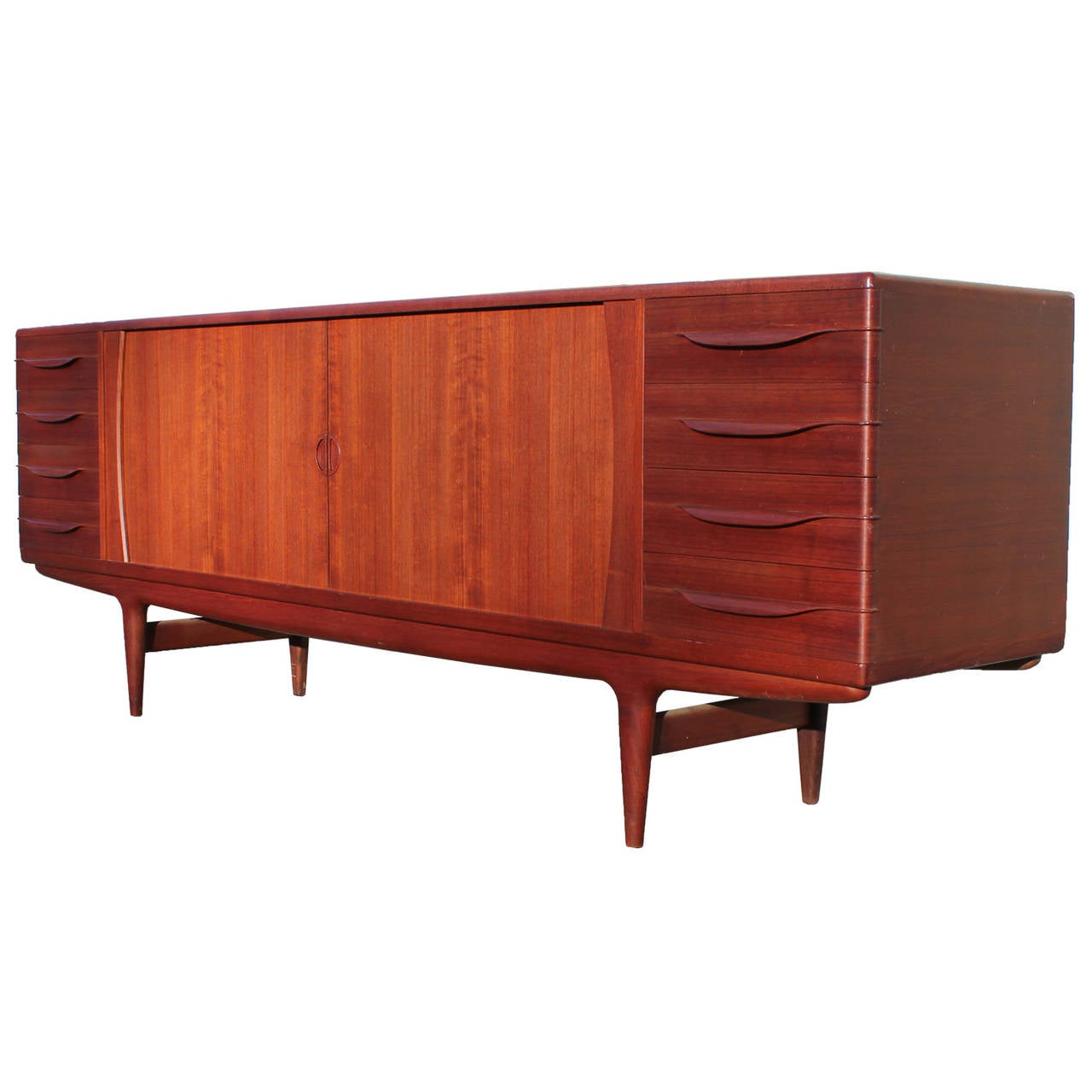 Beautiful credenza designed by Johannes Anderson has incredible attention to detail and craftsmanship. Tambour doors open to reveal adjustable shelving. Eight felt lined drawers provide excellent storage. Top drawers hide an additional sliding