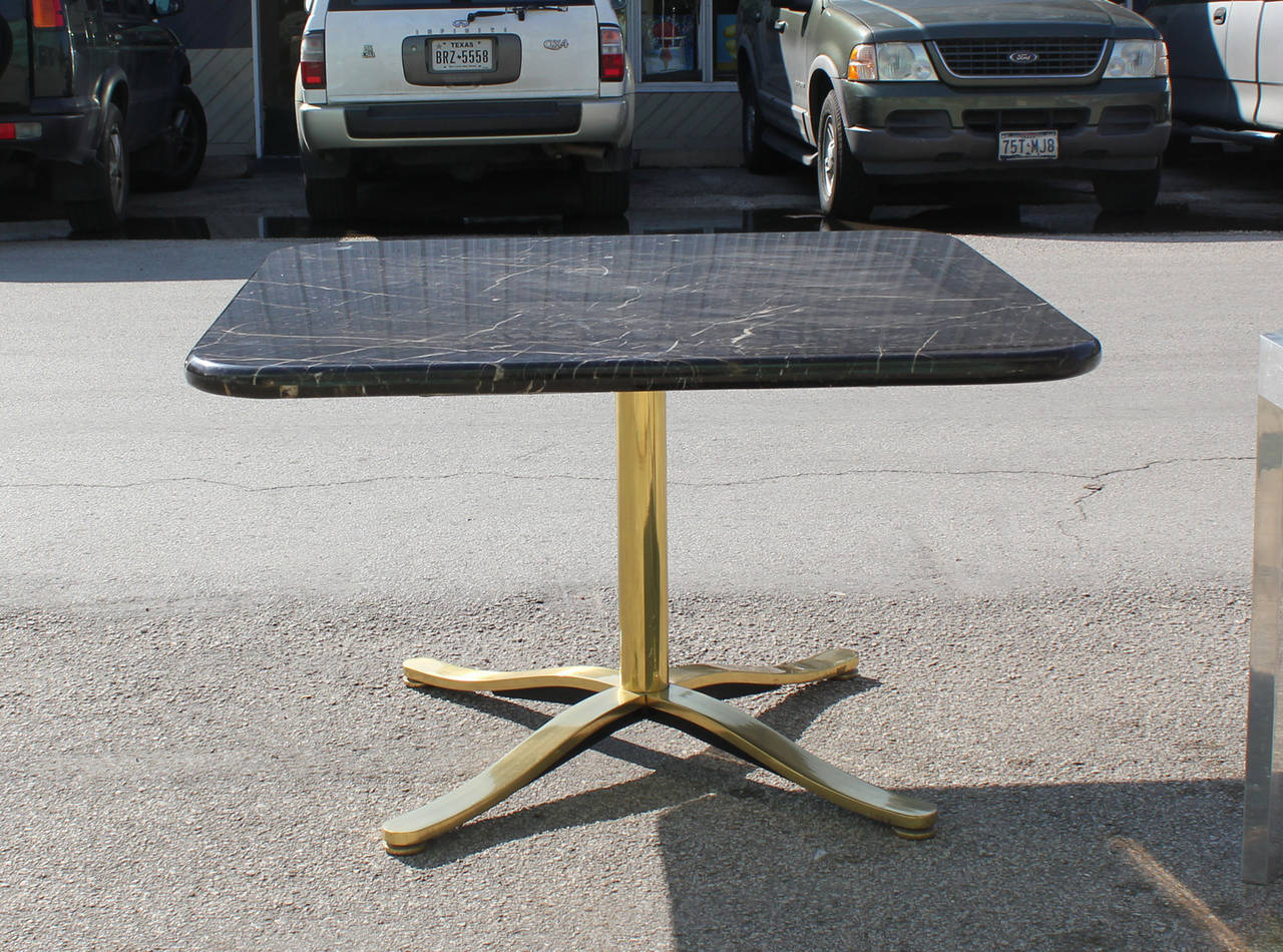 Luxe Brass and black marble Nicos Zographos style dining / breakfast table. 
In excellent vintage condition.