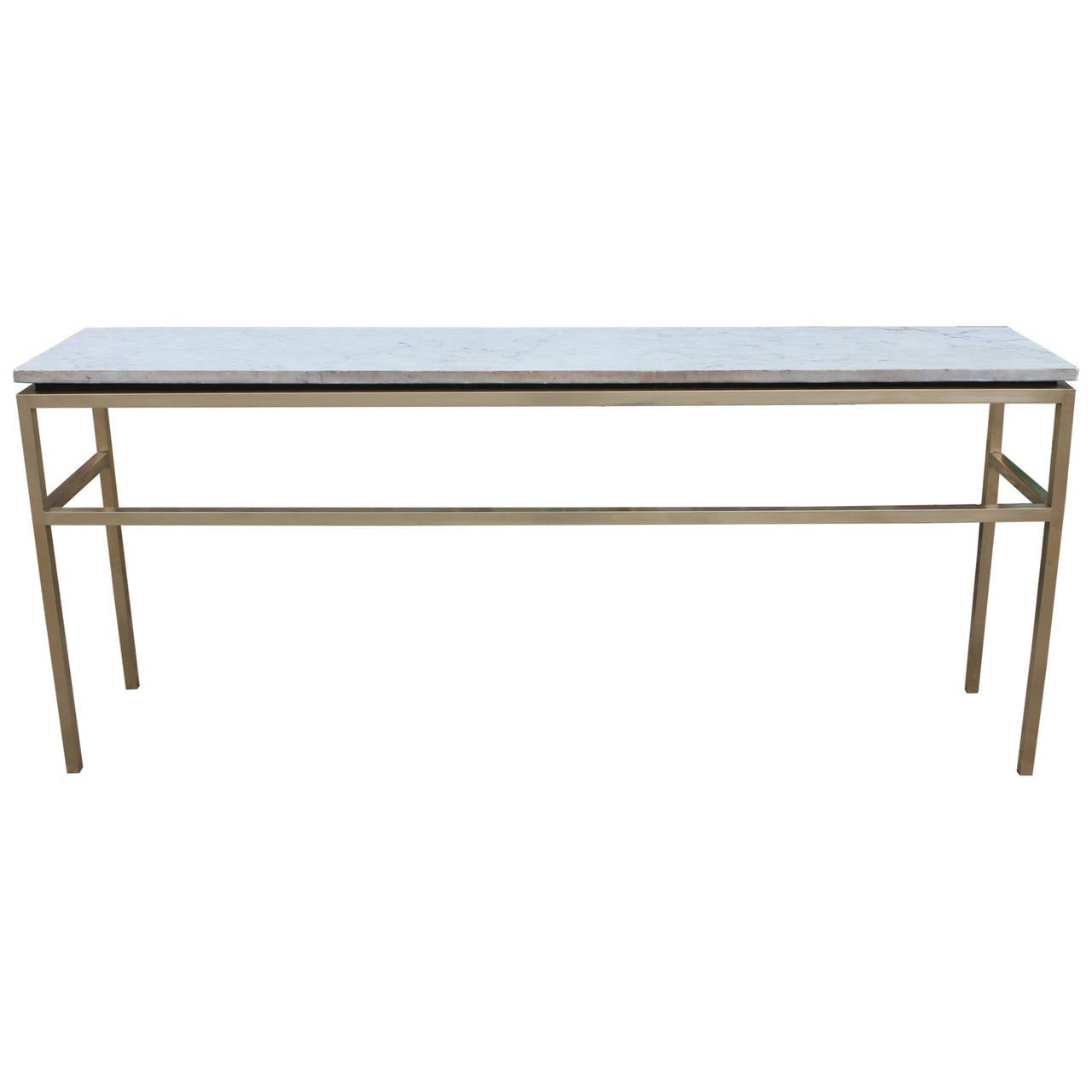 Solid brass and carrara marble console table. Table has clean simple lines providing a certain elegance.