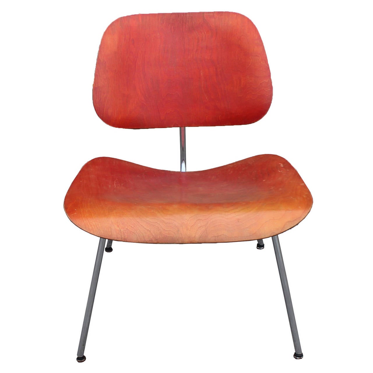 Stunning Eames LCM chair in red. Original red aniline dye finish with a wonderful patina. Classic plywood seat and back on steel frame. In wonderful vintage condition.