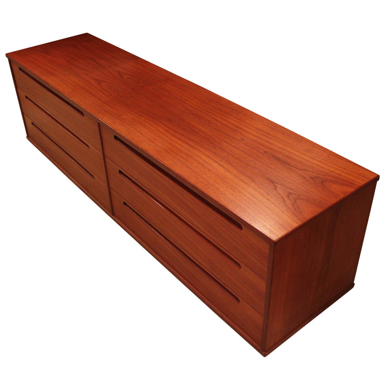 Long and low teak dresser / chest made in Denmark. Six drawers provide ample storage. Perfect at the end of a bed.