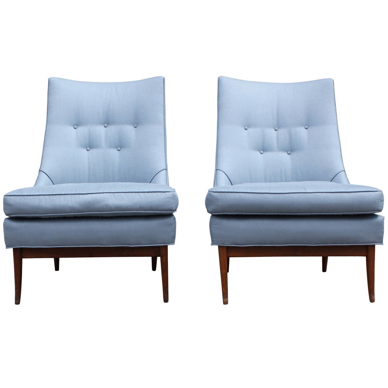 Beautiful pair of slipper chairs upholstered in a silver blue silk. Chairs have soft tapered lines. Front legs curve out elegantly. Upholstery is in great shape.