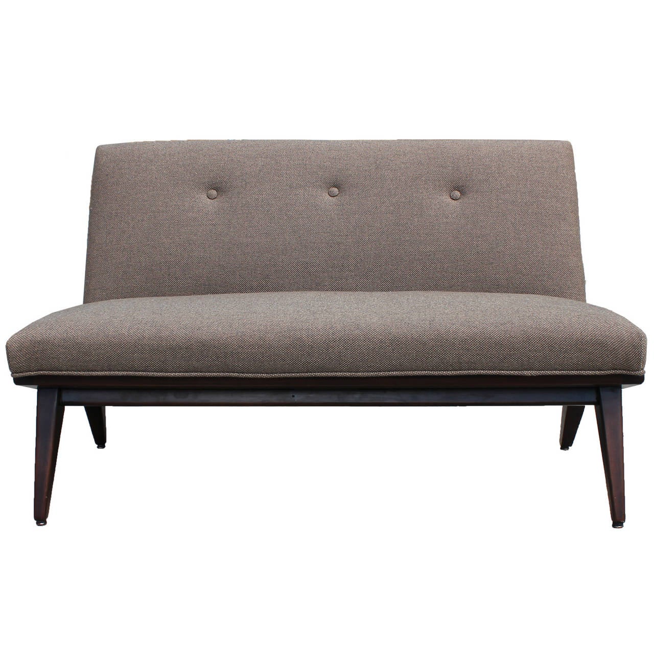 Beautiful Jens Risom settee or armless love seat. Angled walnut base. New Upholstery.