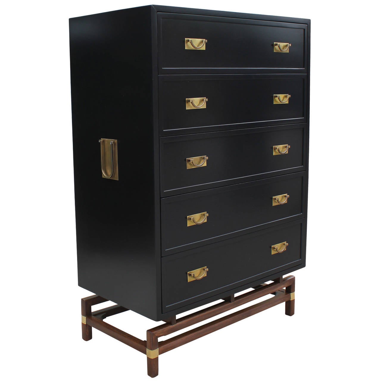 Pair of beautifully constructed twin chests or dressers by Hickory Manufacturing Co. Dressers are lacquered in black with brass details. Dressers sit atop unique walnut and brass stands. Top drawers have three slots for easy organization. Second