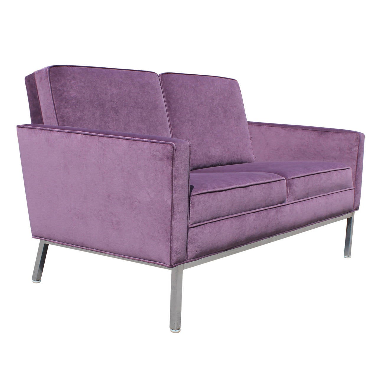 Ultra luxe loveseat / sofa freshly upholstered in purple velvet. Sofa sits atop a stainless base.