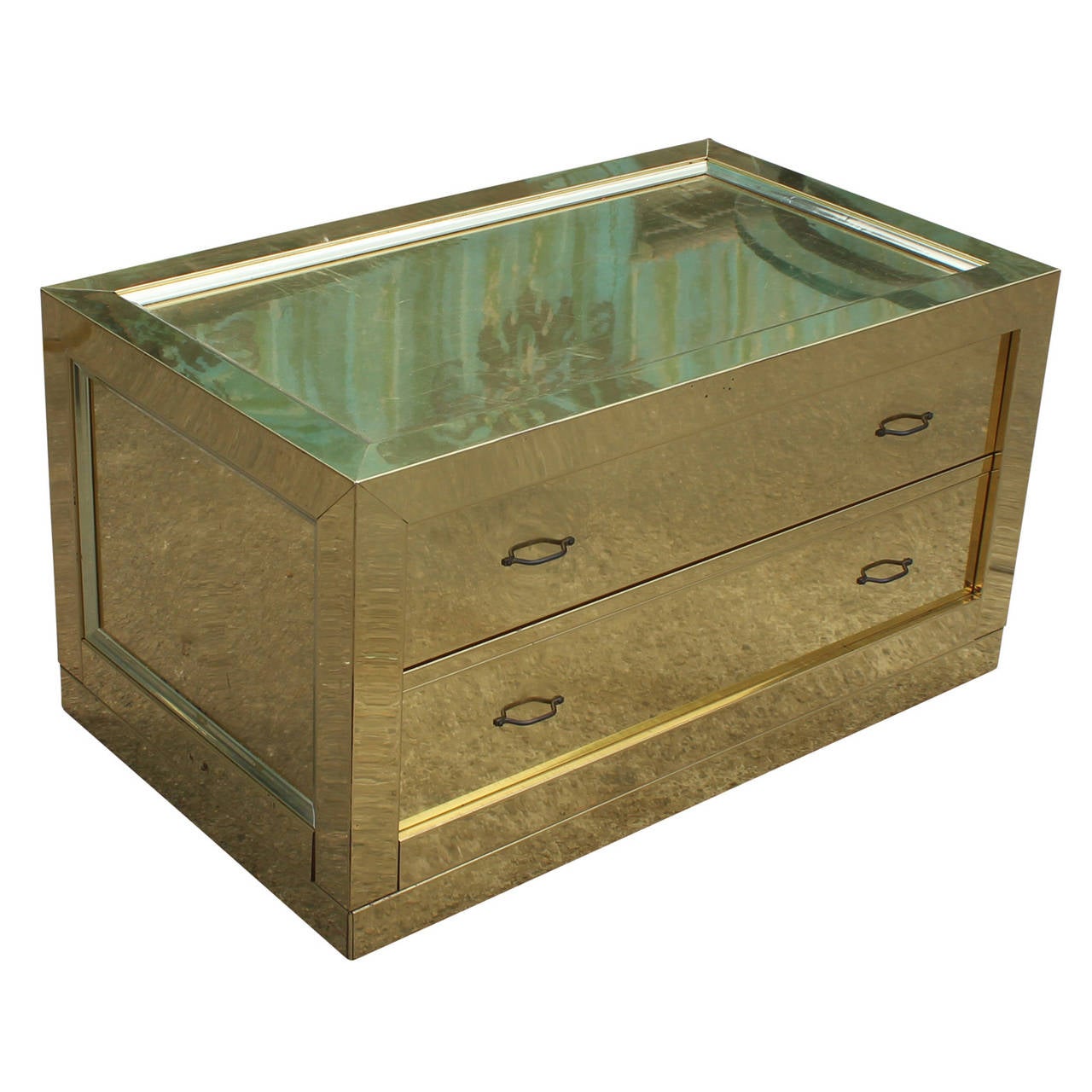 Wonderful little chest covered in brass. Chest has two drawers with simple hardware. Top has some slight scratches.