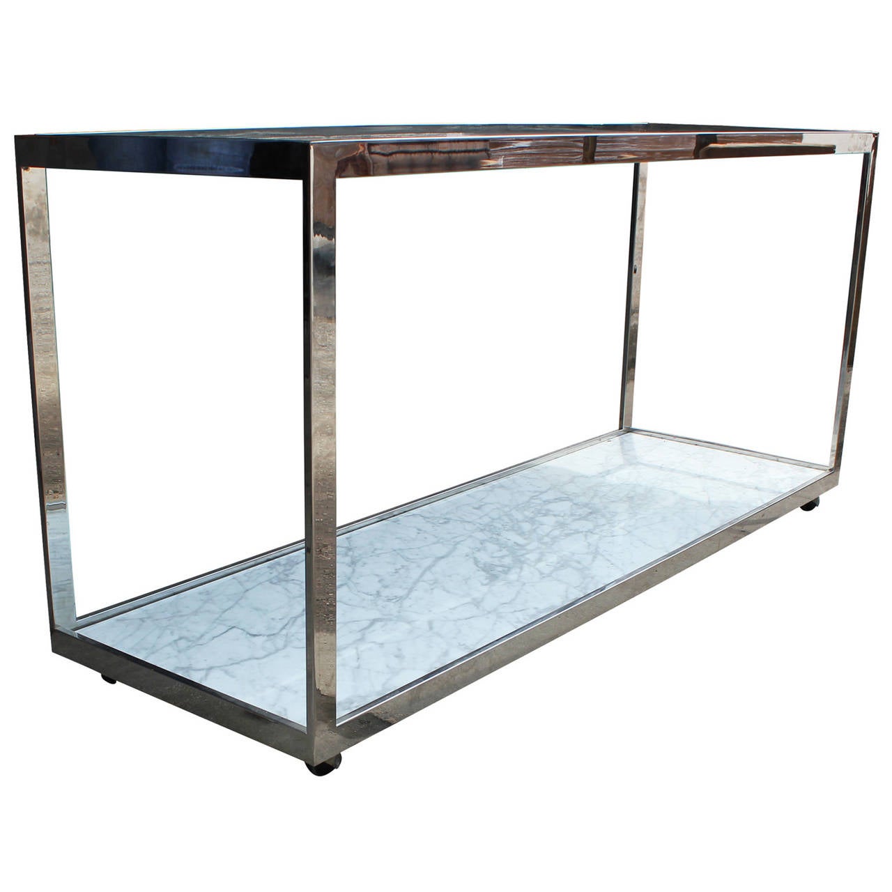 Beautiful clean lined console in chrome. Table top is glass while bottom shelf is a Carrara marble. A truly elegant and timeless piece. Would be a great bar set up or a console table. Great piece!