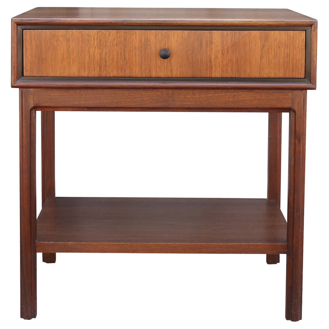 Beautiful pair of nightstands or bedside tables in the style of Paul McCobb. Tables have a small drawer with a dainty round pull. Tables have clean lines with a wonderful attention to detail.