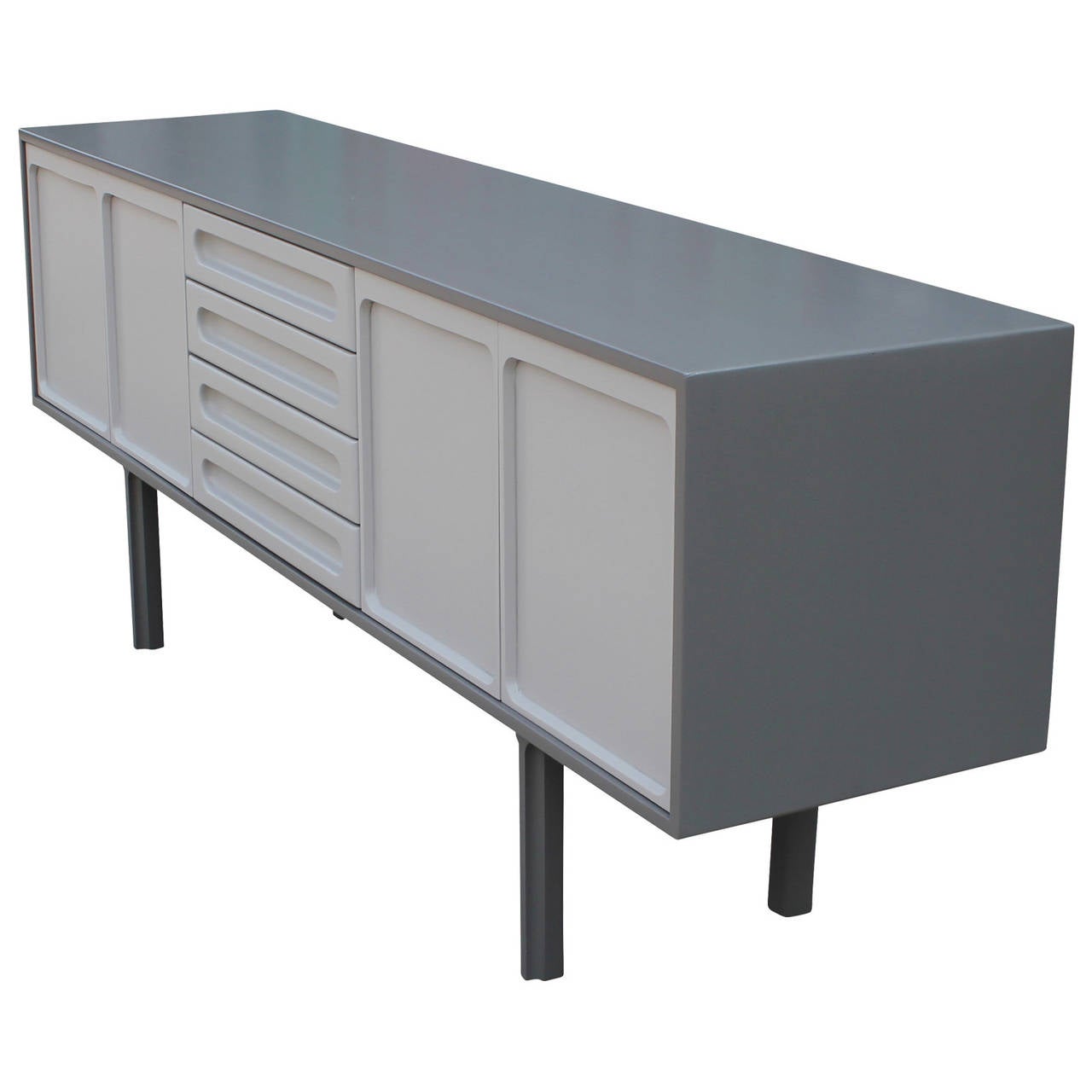 Stunning grey on grey lacquered credenza. Doors on either side open to a single shelf. Four drawers provide ample storage. Subtly detailed legs add visual interest and complement the carved handles. Lacquer quality top notch.