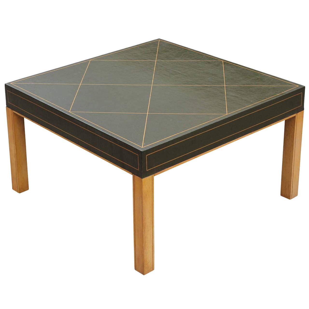 Gorgeous little Parzinger style coffee table. Tabletop is beautifully aged and crackled bottle green leather with gold accents. Base is a gold toned maple. Legs are very simple and clean lined.