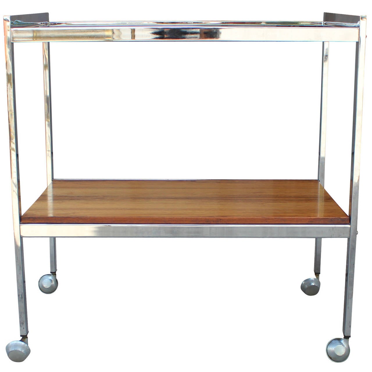 Beautiful chrome framed bar cart. Cart is adorned with smoked glass and a dramatic grained rosewood. Cart is timeless with its elegant clean lines. Great as a side table.