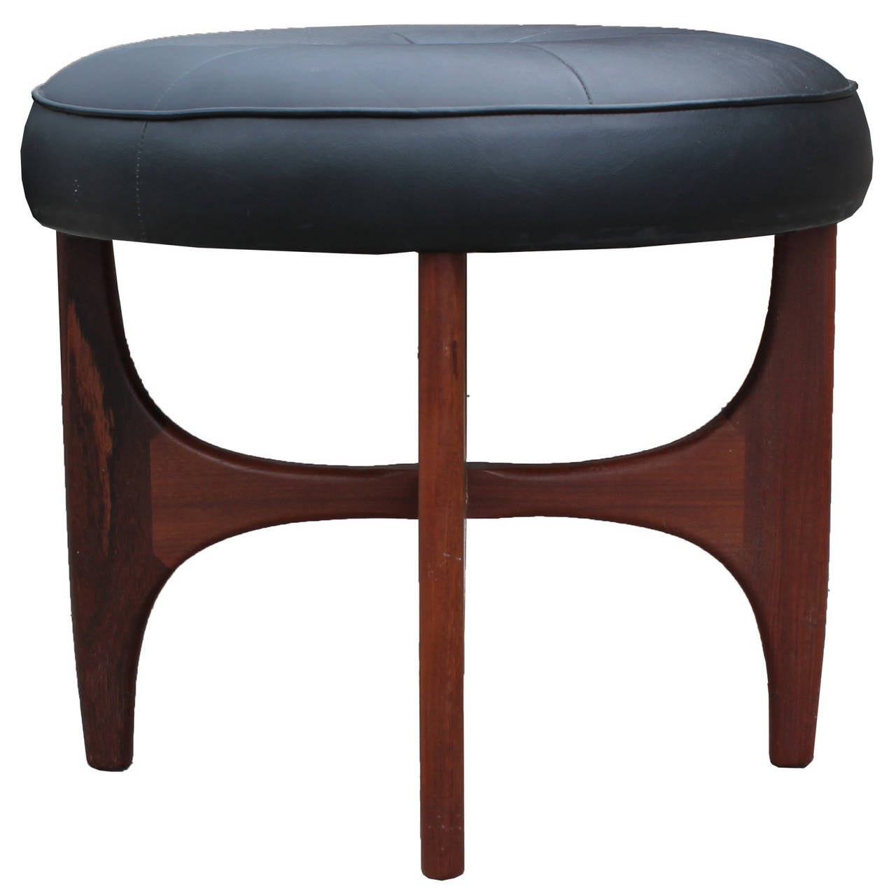 Beautiful pair of sculptural ottomans or stools. Wooden bases are of excellent quality and have an organic feel. Seats are currently covered in black vinyl.