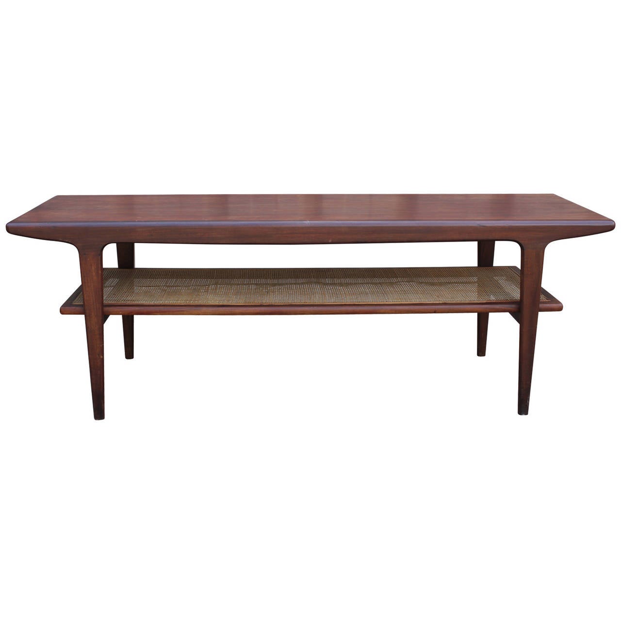 Beautiful Danish Coffee table with a cane shelf. Table has a rounded organic feel. In nice vintage condition.