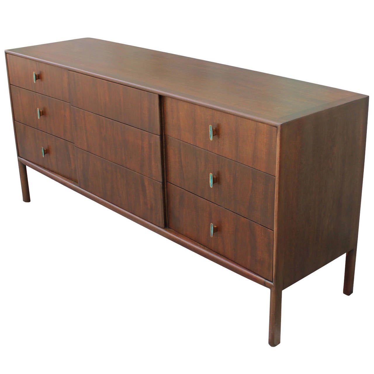 Beautiful and clean lined dresser by Ray Sabota for Mt. Airy. Green enameled brass handles in the style of Pepe Mendoza adds visual interest. Nine drawers provide excellent storage. Matching Gentlemen's chest available.