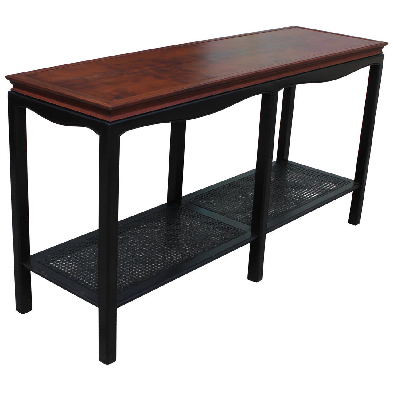 Great Walnut console table with a caned bottom. The bottom of the console has been black lacquered. In the style of Baker furniture designed by Michael Taylor.