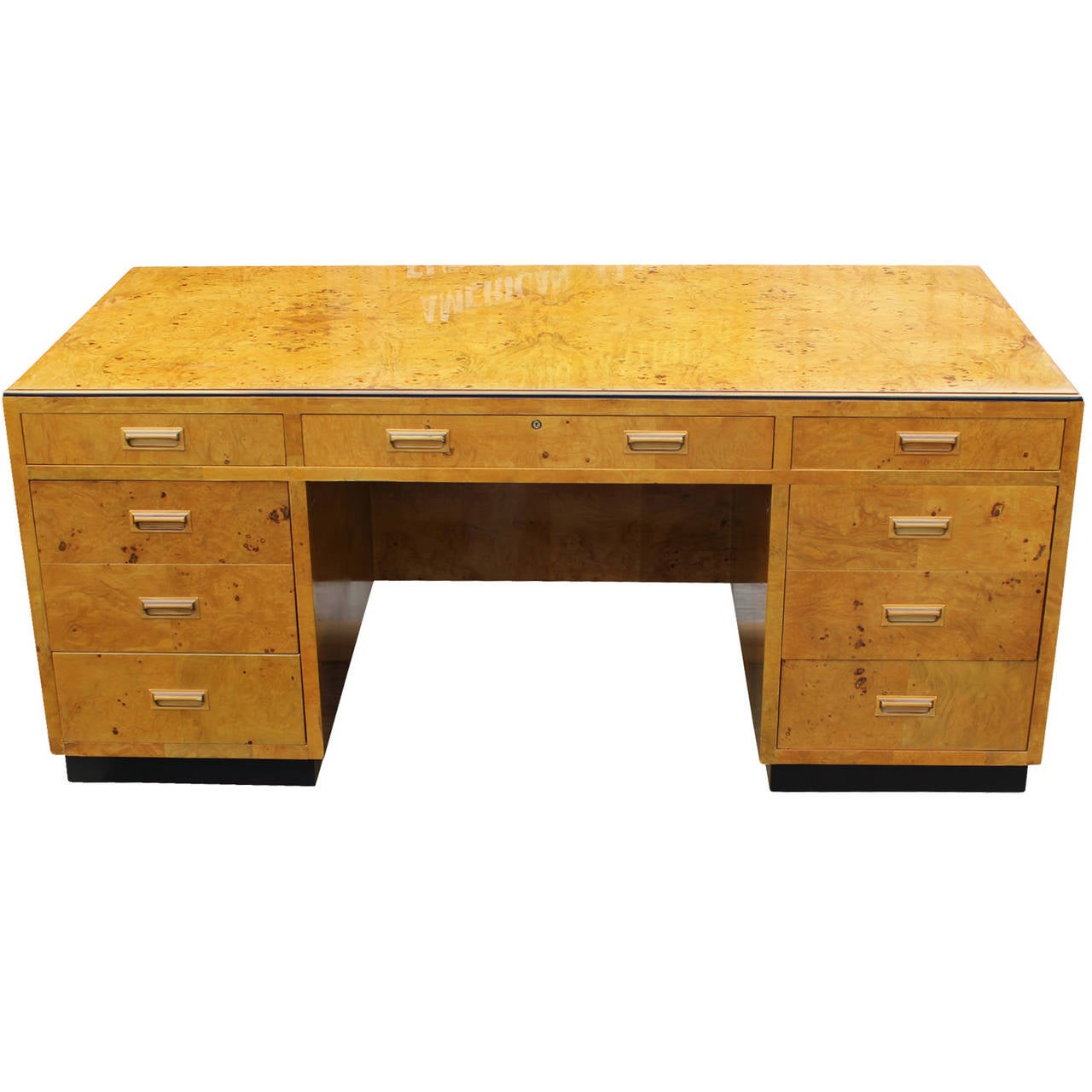 Fabulous executive desk by Henredon, series II. Desk is veneered in the most beautiful blonde burl wood. Desk has been masterfully restored. It has three pull out writing surfaces: one on the right, left, and back. Nine drawers provide excellent