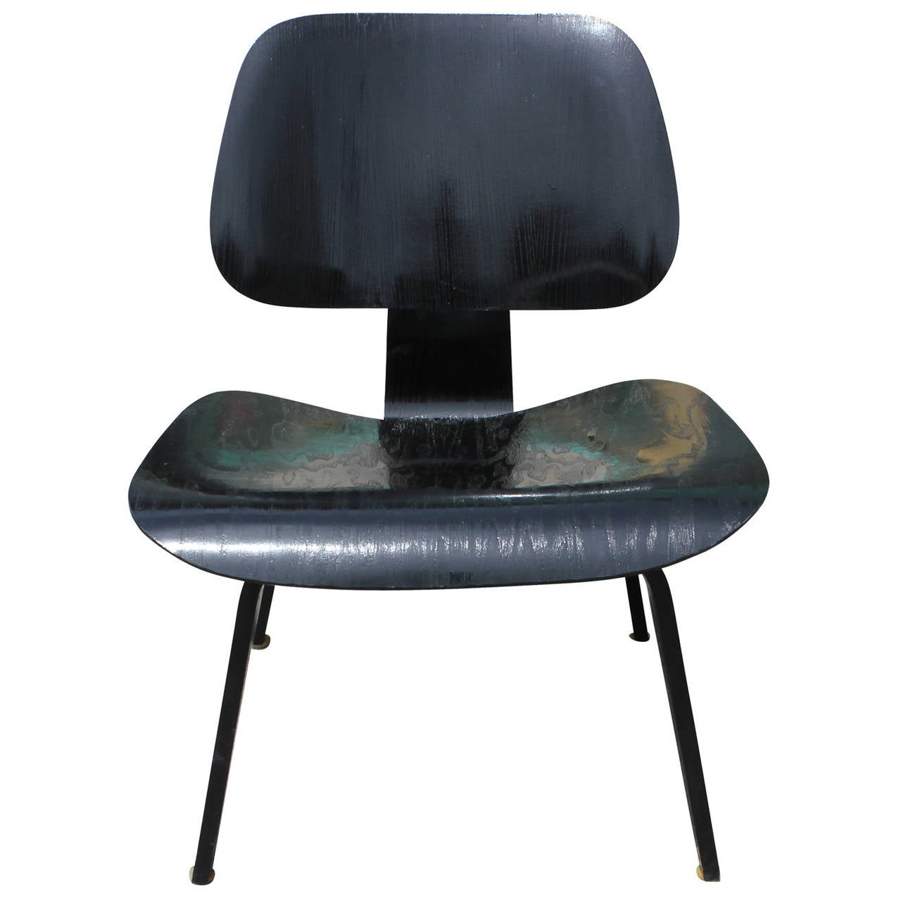 Early Black Eames LCW chair by Herman Miller. Chairs is from circa 1955. Original Black Dye at some point has be cover with a clear coat giving it a bit of shine.