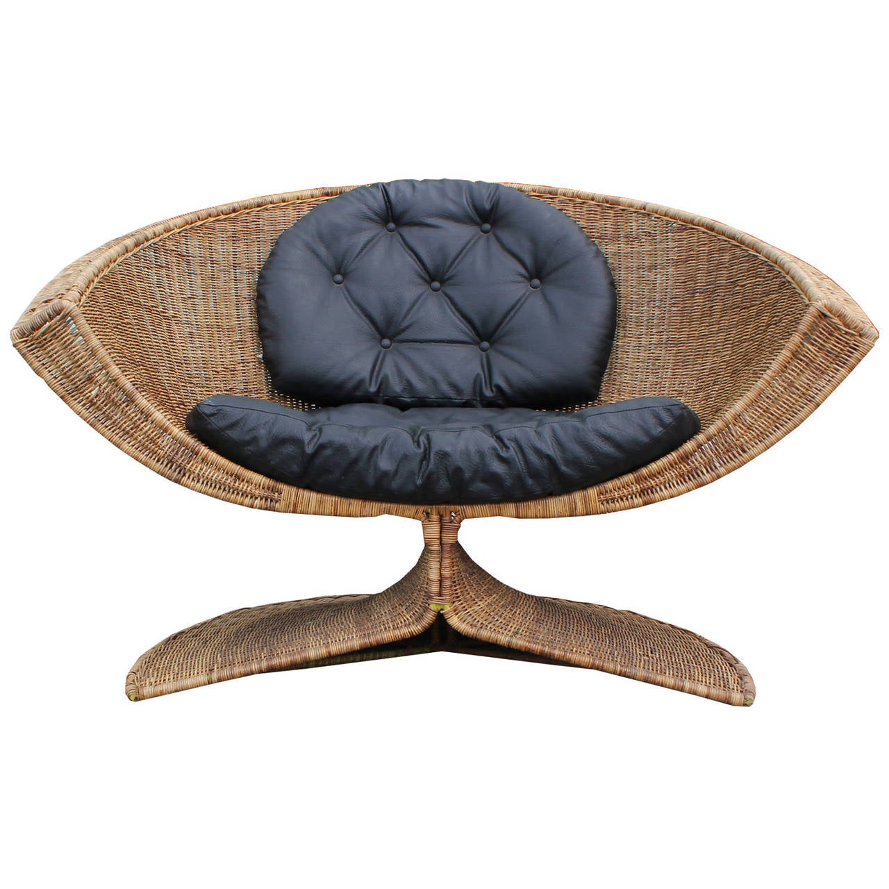 Lotus chair and ottoman by Miller Yee Fng for Tropi-cal designed in 1968. Rattan is in nice vintage condition. Chair retains original black vinyl cushions. Fabulous statement piece!

Ottoman measures 28