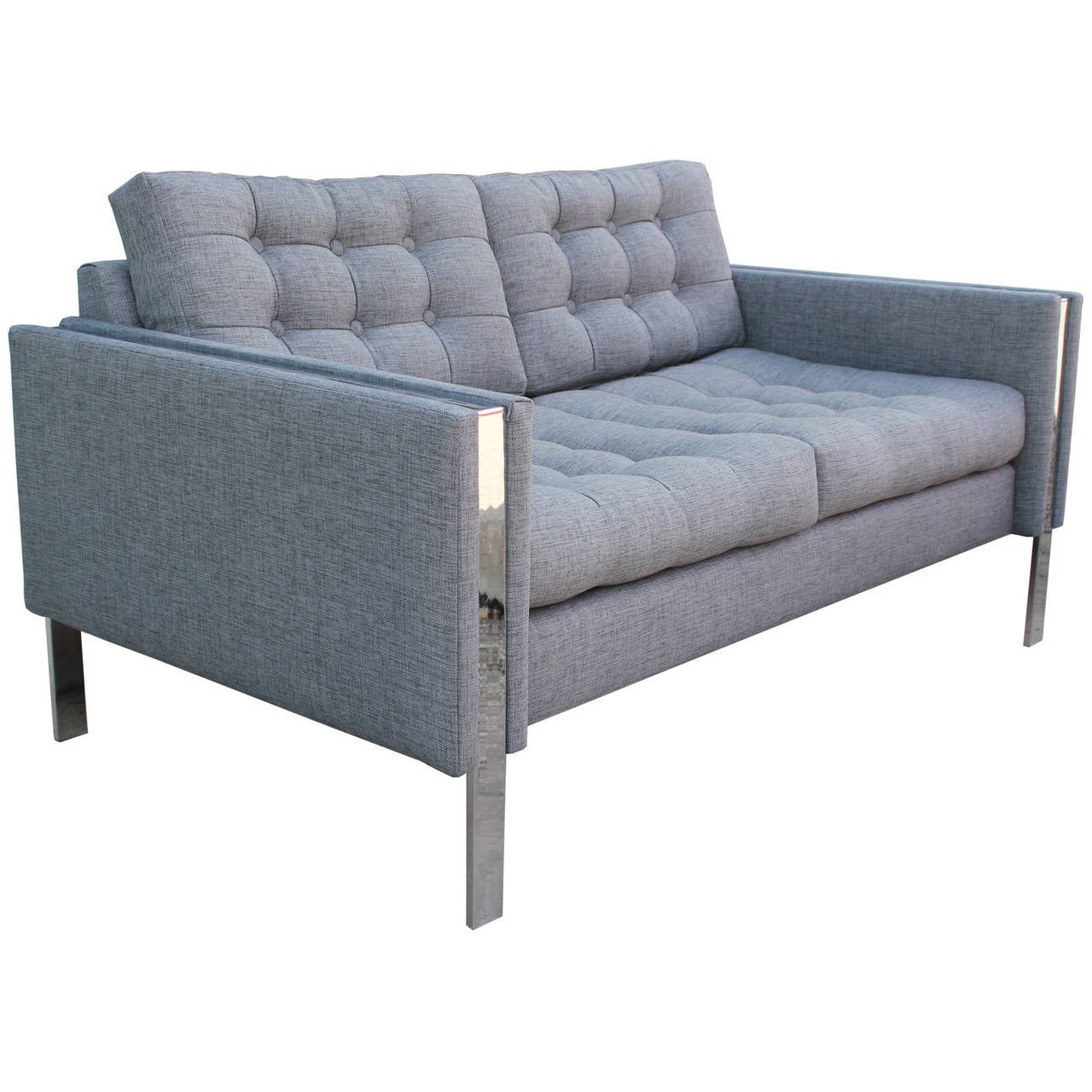 Wonderful love seat or two-seat sofa Attr. Milo Baughman for Thayer Coggin. Chrome flat bar runs through the armrests and become legs. Sofa is upholstered in a recent textured grey fabric and in excellent condition. Tufted cushions add visual