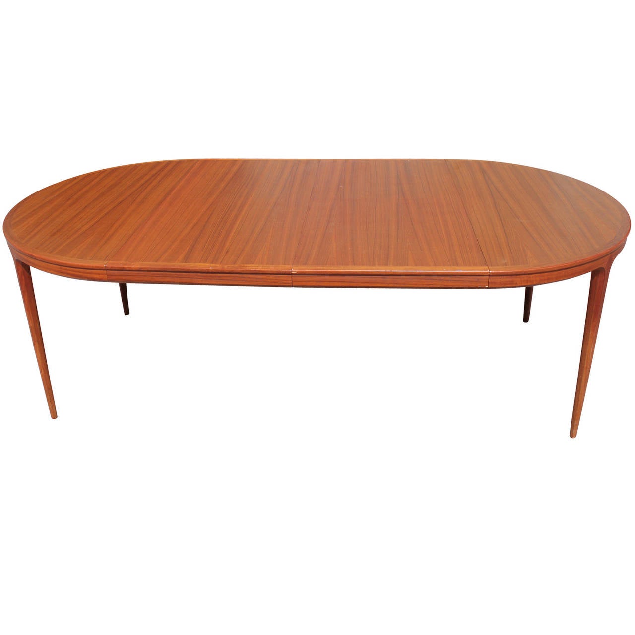 Wonderful Swedish dining table with two leaves designed by B. Fridhagen for Bodafors in 1962. Teak has a lovely grain and is in excellent vintage condition. Table was imported by John Stewart. 

Table is 45